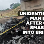 Unidentified man dies after car smashes into bridge