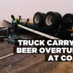 Truck carrying beer overturns at coast